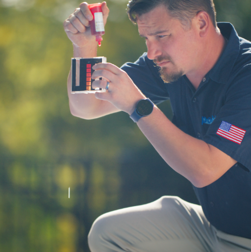 Poolblu technician testing water chemistry